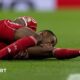 Alexander Isak holding his knee