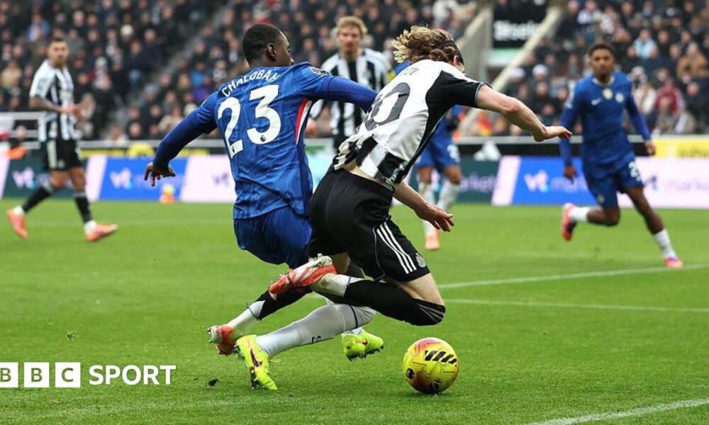 Newcastle forward Anthony Gordon is challenged inside the box by Chelsea defender Trevoh Chalobah