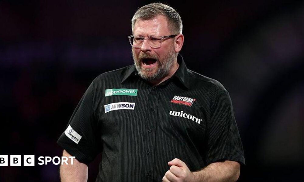 James Wade celebrates