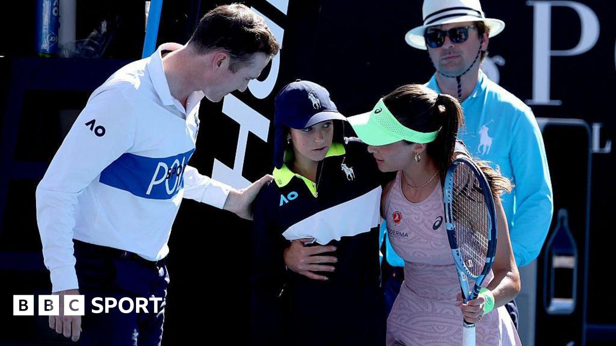 Turkey's Zeynep Sonmez assists a ball kid after she fainted during Sonmez's women's singles match against Russia's Ekaterina Alexandrova