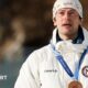 Sturla Holm Laegreid with his bronze medal in the men's 20km individual biathlon