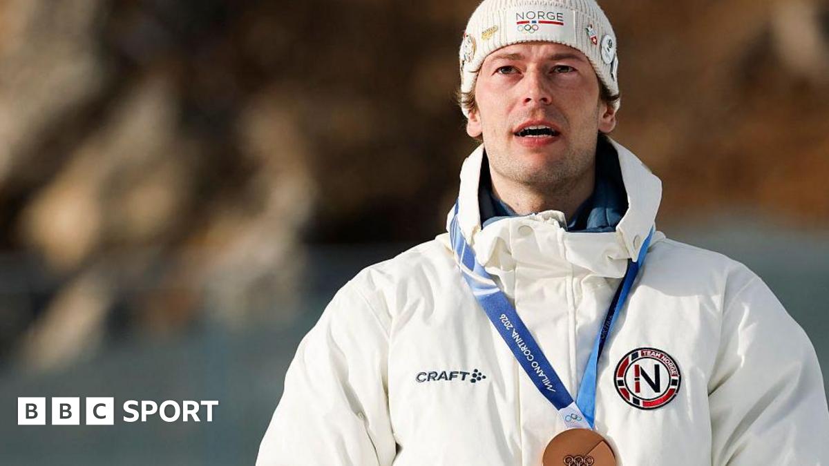 Sturla Holm Laegreid with his bronze medal in the men's 20km individual biathlon