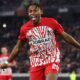 Junior Adamu celebrates after scoring for Freiburg