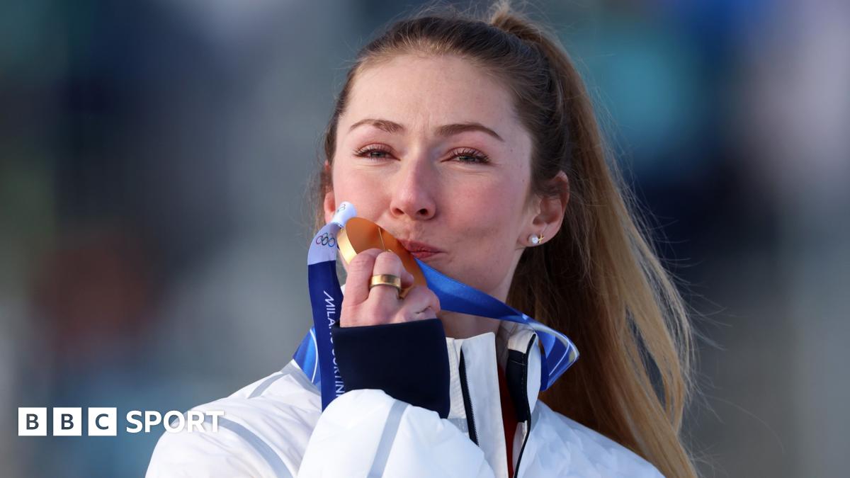 Mikaela Shiffrin crouches on skis after winning Olympic gold in slalom in Cortina