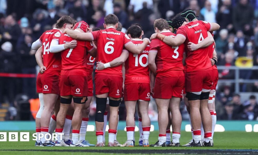 Wales players in a huddle against England