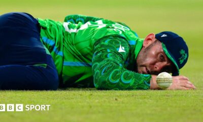 Ireland's Ross Adair lies on the ground after missing a catch