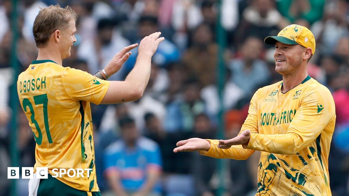 Corbin Bosch of South Africa celebrates taking the wicket of Sohaib Khan of the United Arab Emirates