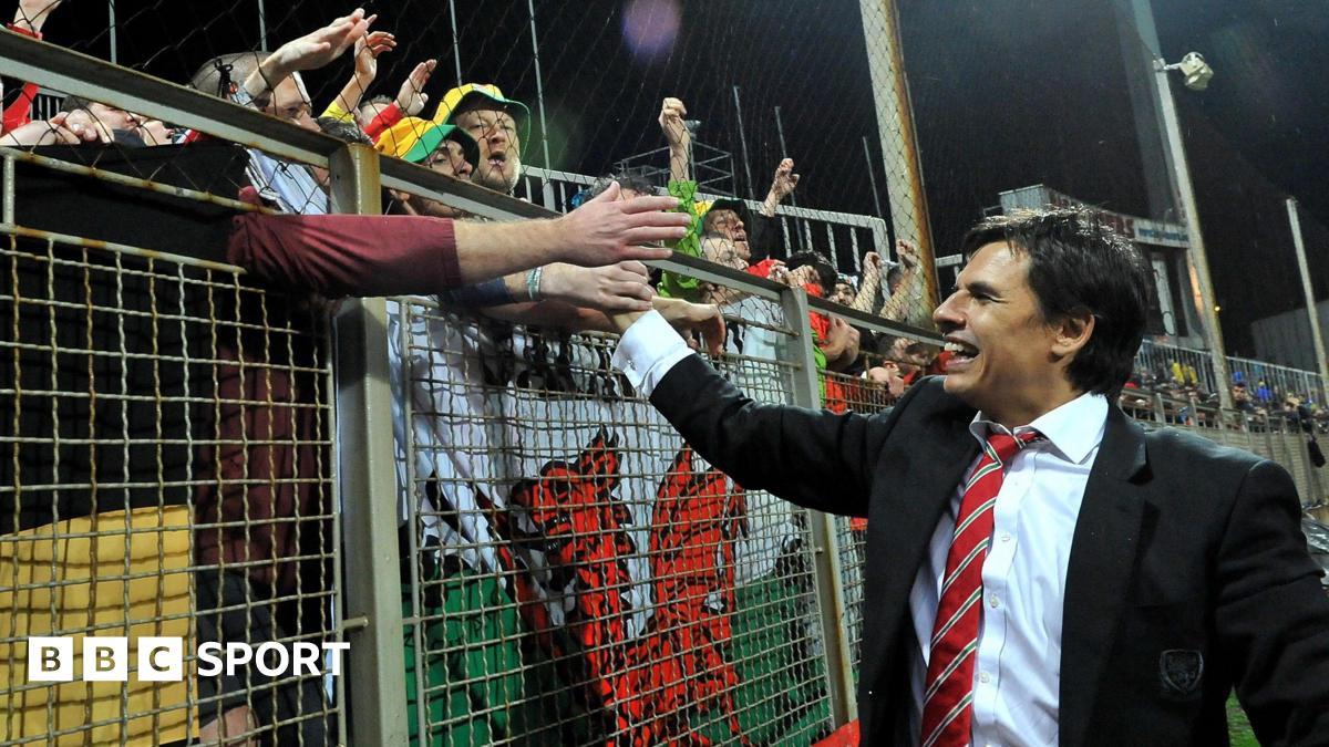 Chris Coleman celebrates with Wales fans after qualifying for Euro 2016 following the 2-0 loss in Bosnia-Herzegovina in 2015