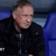 Blackburn Rovers boss Michael O'Neill sits in the Oxford United dugout at the Kassam Stadium