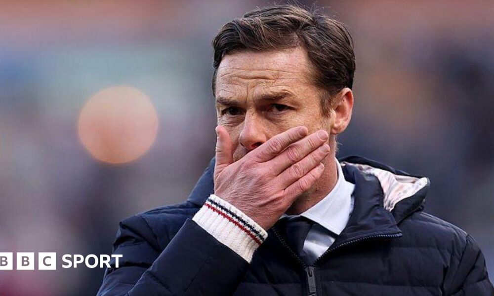Scott Parker holds his face