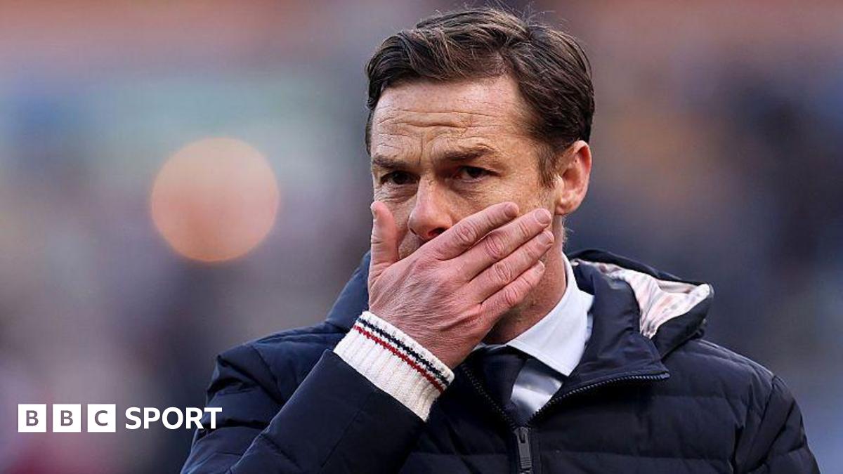 Scott Parker holds his face