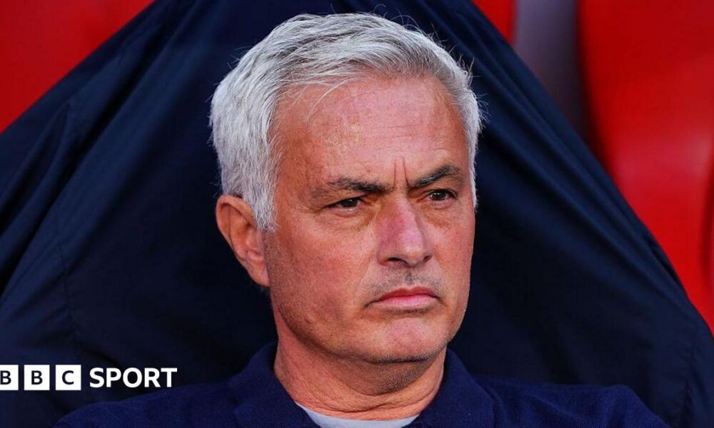 Jose Mourinho looks on in the Benfica dugout