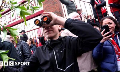 A fan is seen using binoculars outside the stadium prior to the Championship play-off semi-final match between Middlesbrough and Southampton at Riverside Stadium