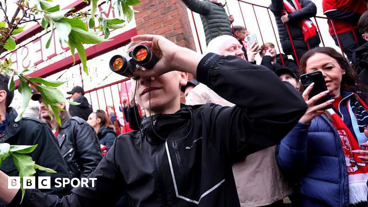 A fan is seen using binoculars outside the stadium prior to the Championship play-off semi-final match between Middlesbrough and Southampton at Riverside Stadium