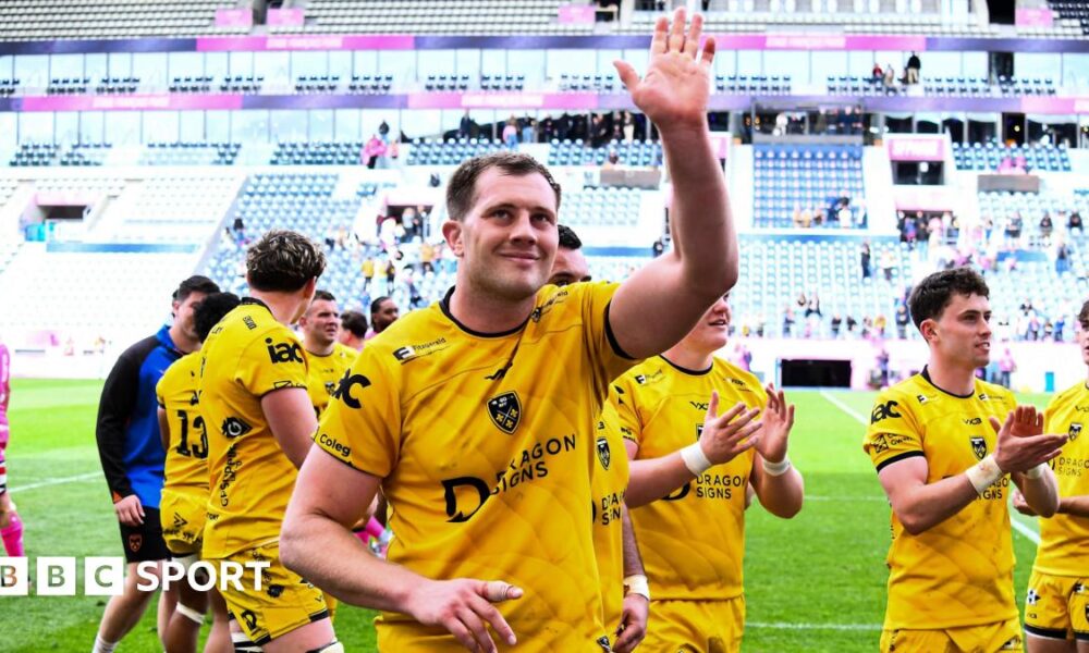 Dragons co-captain Ben Carter waves to the crowd after helping his side beat Stade Francais
