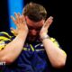 An emotional Luke Littler wipes away tears after beating Luke Humphries to win  the 2026 Premier League Darts