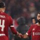 Virgil van Dijk and Mohamed Salah playing for Liverpool
