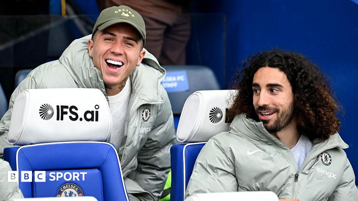 Enzo Fernandez joking with Marc Cucurella on Chelsea's bench