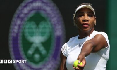 Serena Williams prepares to toss a tennis ball in practice at Wimbledon