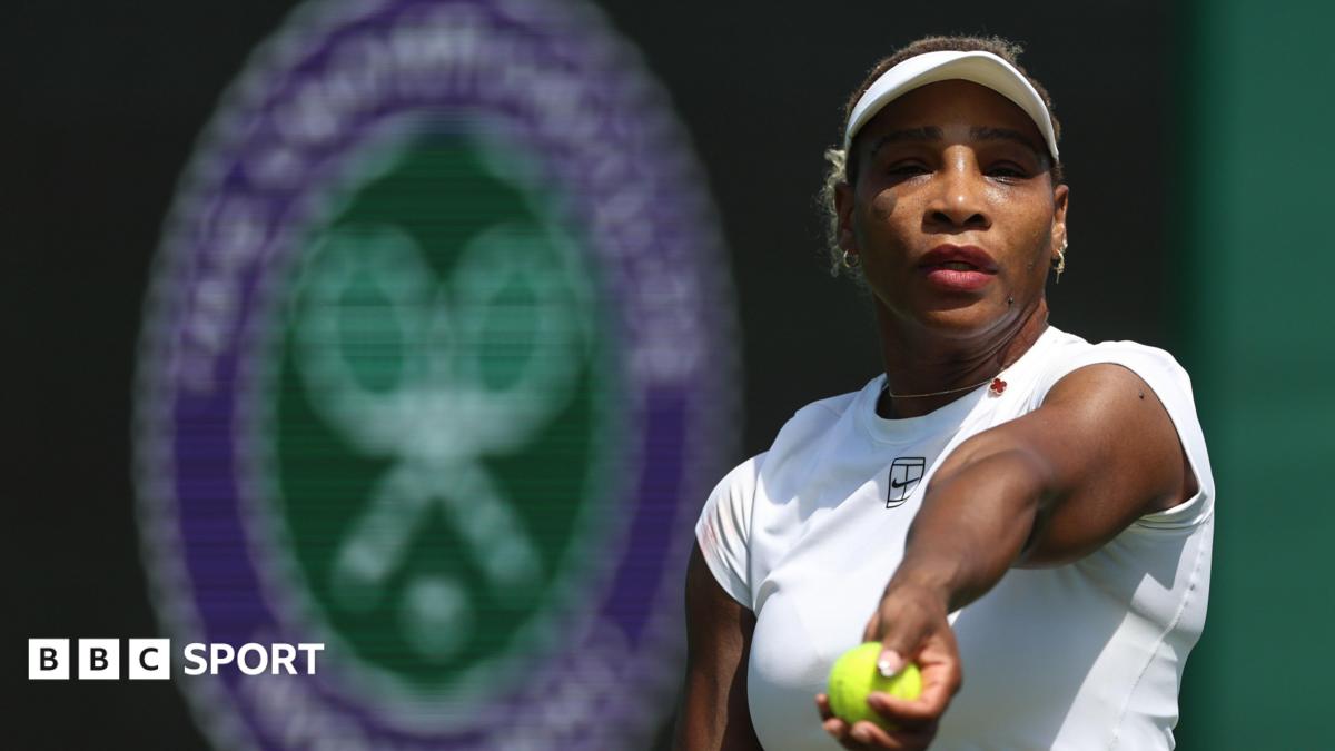 Serena Williams prepares to toss a tennis ball in practice at Wimbledon