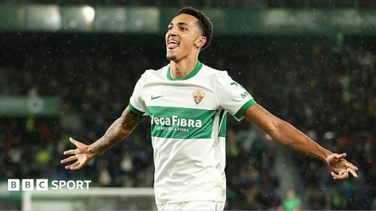 Alvaro Rodriguez celebrates a goal for Elche with his arms out wide
