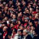 Manchester United fans applaud before kick off of a Premier League fixture against Liverpool
