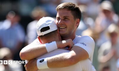 Henry Patten embraces team-mate Harri Heliovaara after winning the Wimbledon men's doubles title