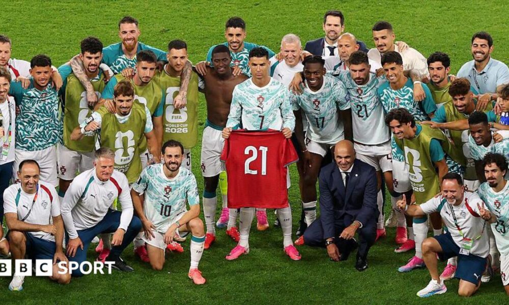 Cristiano Ronaldo holds Diogo Jota's '21' shirt aloft for Portugal