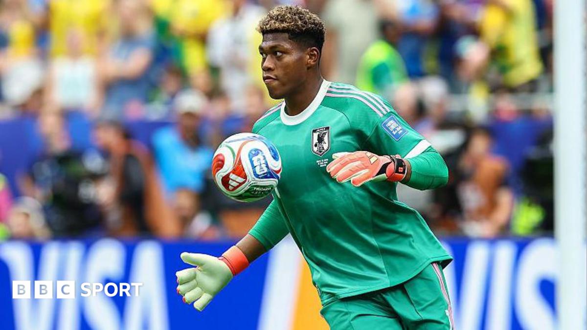 Zion Suzuki controls the ball with his chest while playing for Japan at the World Cup