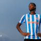 Stephen Mfuni poses in Coventry City's 2025-26 kit