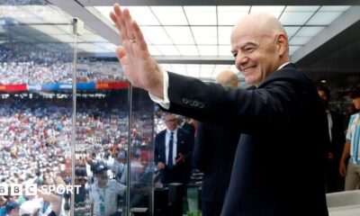 FIFA president Gianni Infantino waves before the World Cup final between Spain and Argentina
