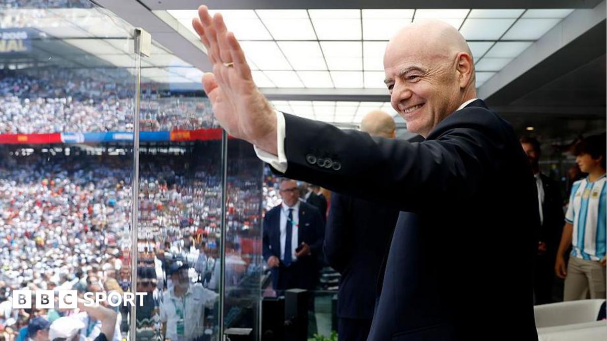 FIFA president Gianni Infantino waves before the World Cup final between Spain and Argentina