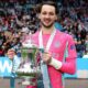 Manchester City goalkeeper James Trafford holding the FA Cup trophy at Wembley Stadium