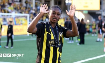 Monica Jusu Bah waving to the crowd while wearing a BK Hacken kit