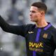 Robbie Ure punches the air while wearing the largely black kit of his former team Anderlecht