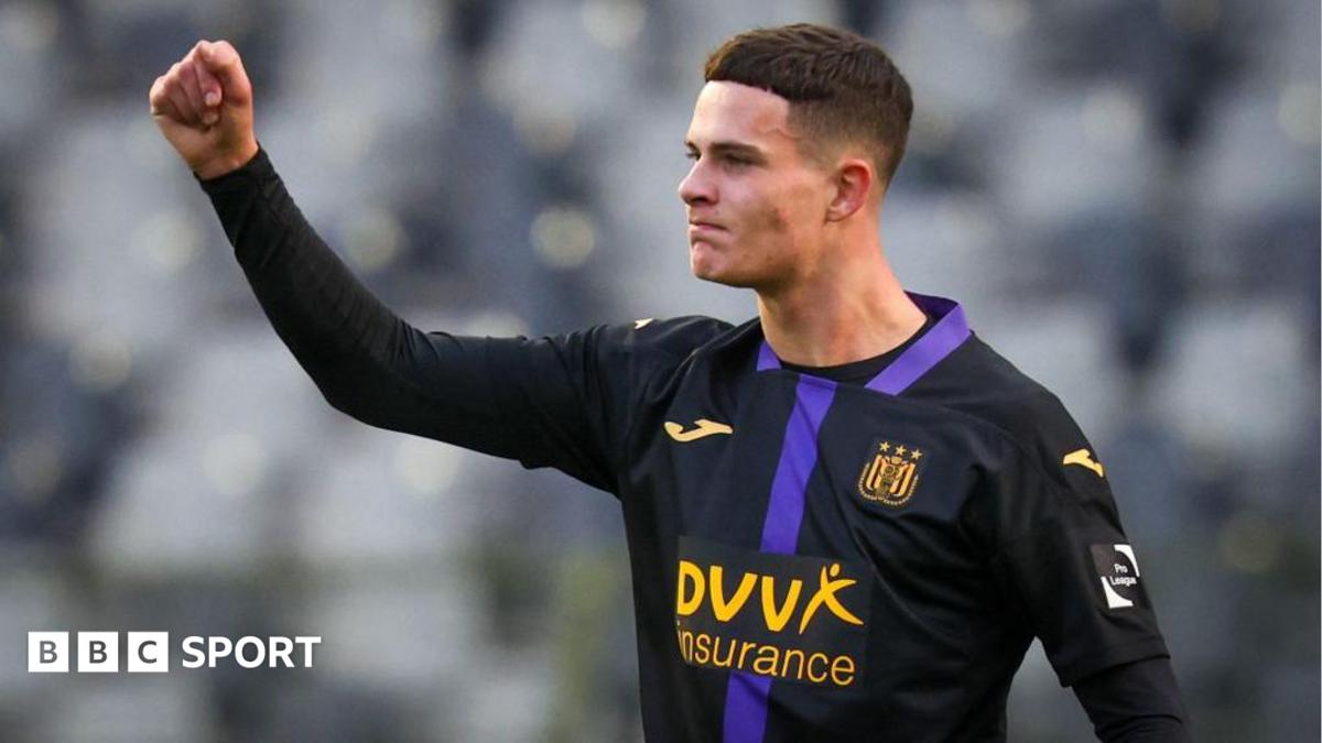 Robbie Ure punches the air while wearing the largely black kit of his former team Anderlecht