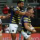 George Williams (right) celebrates scoring for Warrington against Hull KR