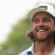 Tommy Fleetwood smiles on the first tee
