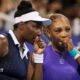 Venus Williams (left) speaks to Serena Williams during their US Open first-round doubles match in 2022