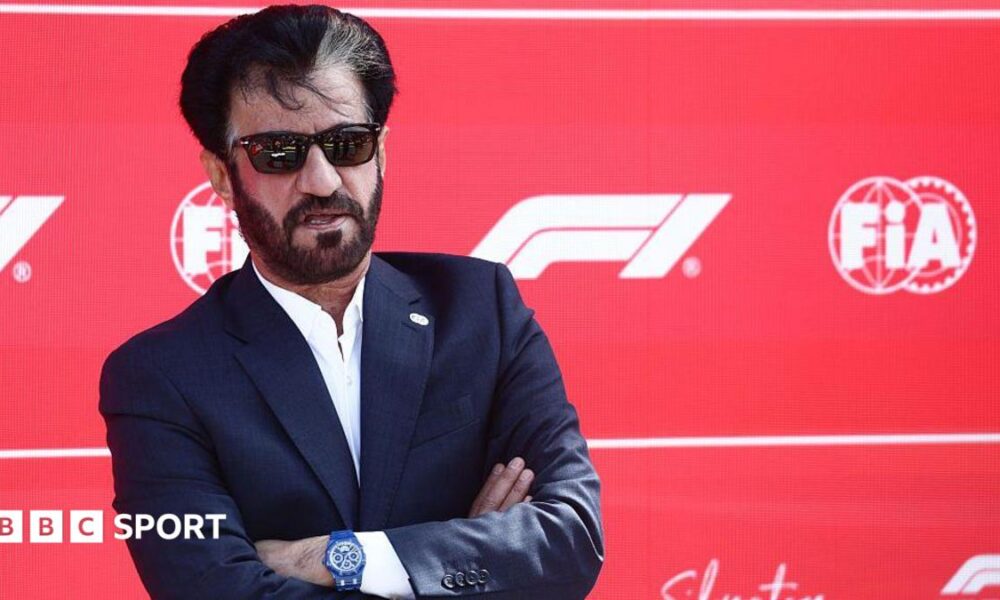Mohammed Ben Sulayem in sunglasses against a F1 background