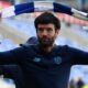 Brian Barry-Murphy swings a scarf above his head after guiding Cardiff to promotion from League One.