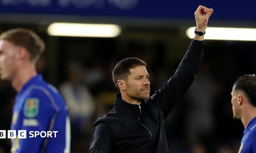 Xabi Alonso celebrates after Chelsea's win over Leeds United, raising his left arm in a satisfied salute