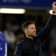 Xabi Alonso celebrates after Chelsea's win over Leeds United, raising his left arm in a satisfied salute