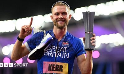 Josh Kerr celebrates while holding the 1500m trophy after winning the inaugural World Athletics Ultimate Champion event in Budapest, Hungary