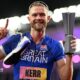Josh Kerr celebrates while holding the 1500m trophy after winning the inaugural World Athletics Ultimate Champion event in Budapest, Hungary