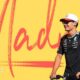 George Russell scoots past a Madrid sign