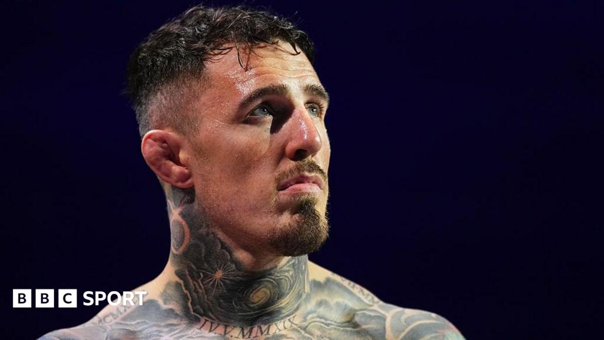 Head and shoulders view of heavily tattooed Tom Aspinall