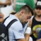 Arthur Gea wipes his face as he walks off court at the US Open