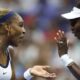 Serena and Venus Williams celebrate winning a point at the 2026 US Open