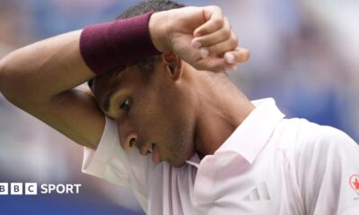 Felix Auger-Aliassime wipes his brow during his US Open defeat by Karen Khachanov